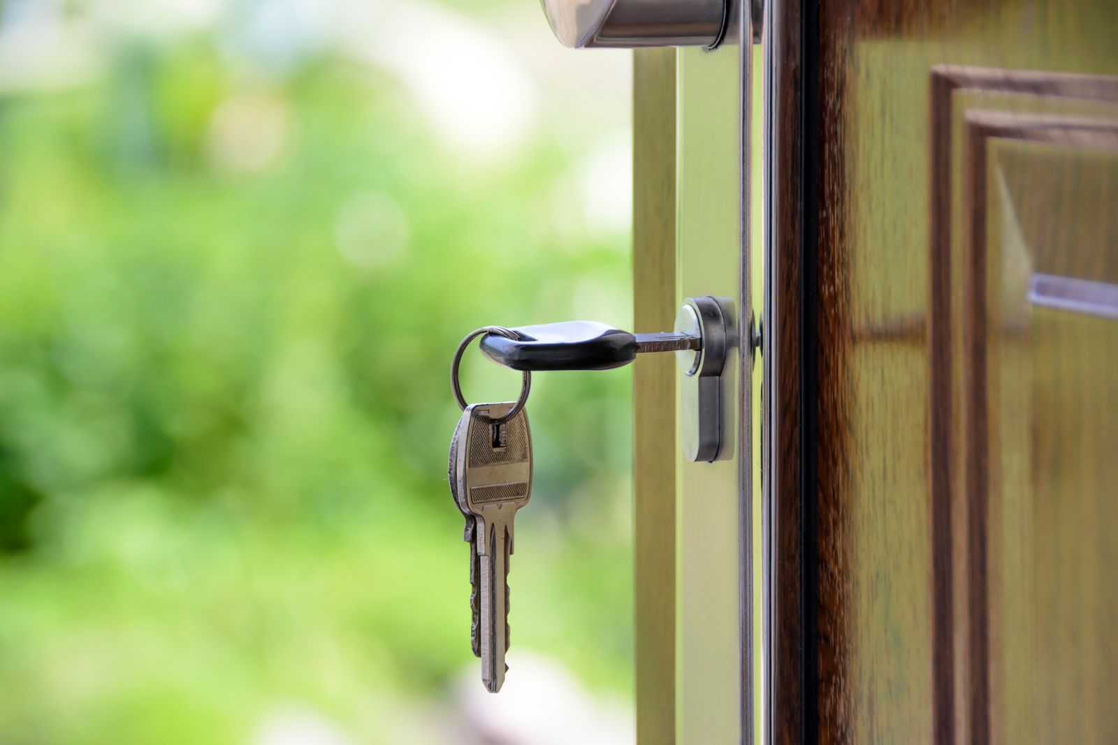 Key inserted in a door lock, representing home security and privacy